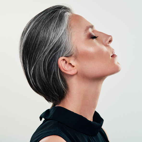 Knoxville jeuveau model in a black shirt looking upwards